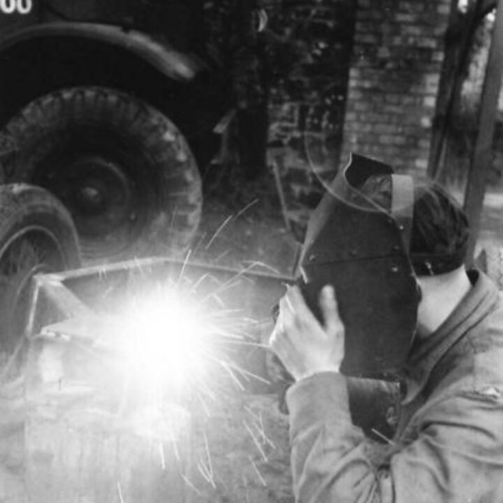 Craftsman Cathcart of Greenock, Scotland welding using power from a lorry engine at 3 Non Divisional Engineers, Royal Electrical and Mechanical Engineers base workshop at Gilford, Co. Down.