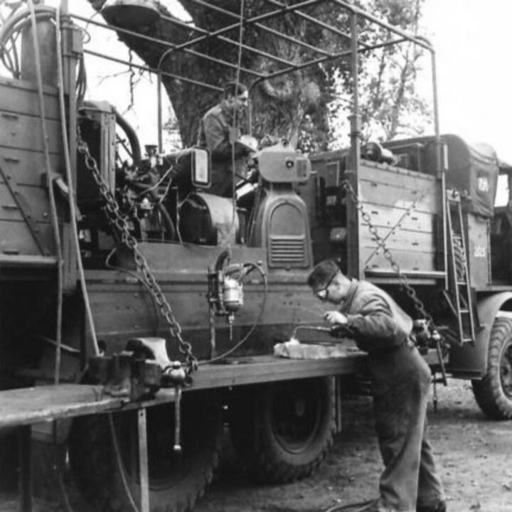 Craftsman Fingleton of Manchester, England and Craftsman J. Lyons of Greenock, Scotland at work in a mobile machinery lorry at 3 Non Divisional Engineers, Royal Electrical and Mechanical Engineers base workshop at Gilford, Co. Down.