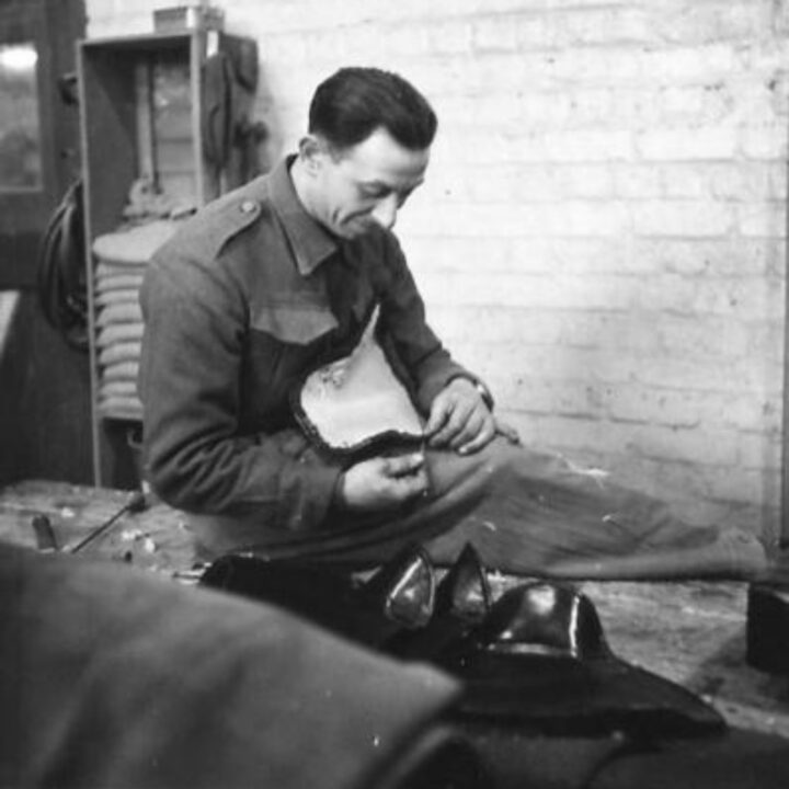 Craftsman Coplovitch of Tottenham, London, England working making motorcycle seats at a Royal Electrical and Mechanical Engineers base workshop at Kinnegar Barracks, Holywood, Co. Down.