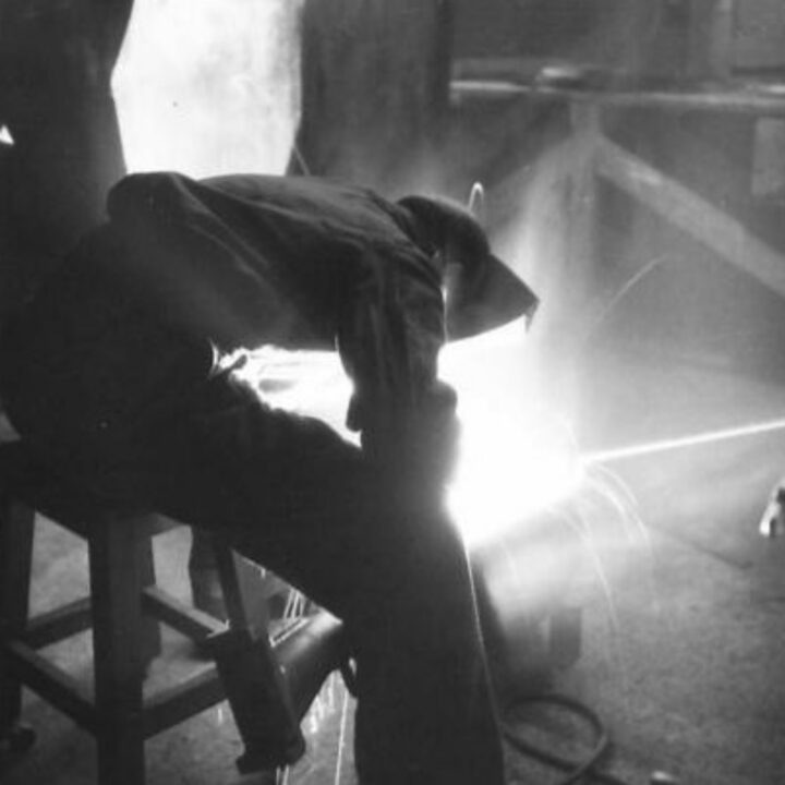 Craftsman E.J. Jones of Edmonton, London, England working as an electric arc welder at a Royal Electrical and Mechanical Engineers base workshop at Kinnegar Barracks, Holywood, Co. Down.