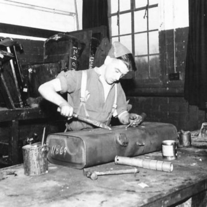 Craftsman P. Hawkins of Swinford, Co. Mayo, Ireland working soldering petrol tanks at a Royal Electrical and Mechanical Engineers base workshop at Kinnegar Barracks, Holywood, Co. Down.