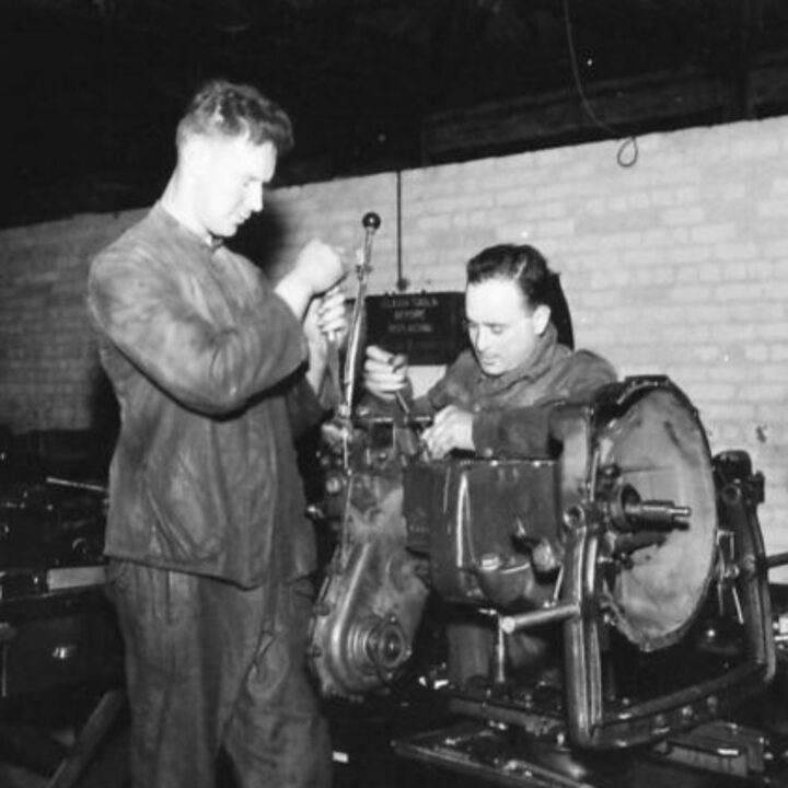 Craftsman J. Stacey of Shillelagh, Co. Wicklow, Ireland and Craftsman M. Toshner of Glasgow, Scotland working repairing an engine at a Royal Electrical and Mechanical Engineers base workshop at Kinnegar Barracks, Holywood, Co. Down.