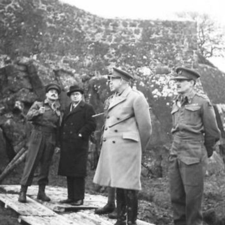 The Right Honourable Sir James Grigg K.C.B., K.C.S.I, P.C. (Secretary of State for War) and Lieutenant-General Sir Harold Edmund Franklyn (in British Warm) observe British Army toughening up and weapon training in Ulster.
