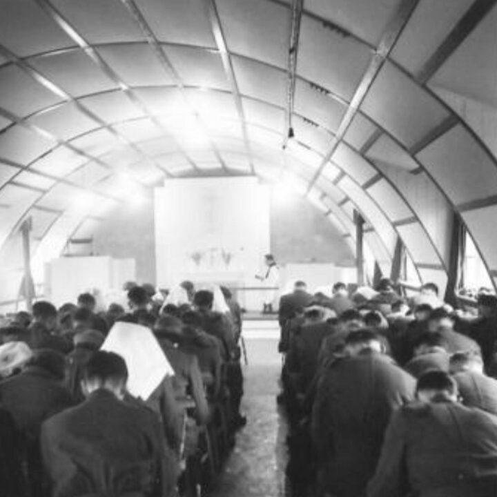 Reverend L.F. Hamel-Smith M.A. (Senior Chaplain to the Forces, Northern Ireland District) conducts a dedication service of a new chapel at a military hospital in Northern Ireland. Nurses working at the hospital attended the service.