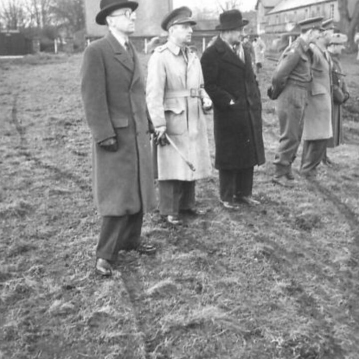 L-R: The Honorable R.B. Beaumont M.P. (Principal Parliamentary Secretary to the Secretary of State for War), Major Baker (Royal Army Service Corps), The Right Honourable Sir James Grigg K.C.B., K.C.S.I, P.C. (Secretary of State for War) at a British Army base in Northern Ireland.