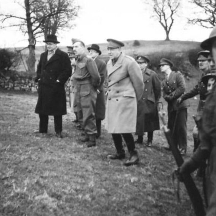 The Right Honourable Sir James Grigg K.C.B., K.C.S.I, P.C. (Secretary of State for War) and Officers observing mortar firing training at a British Army Battle School in Northern Ireland.