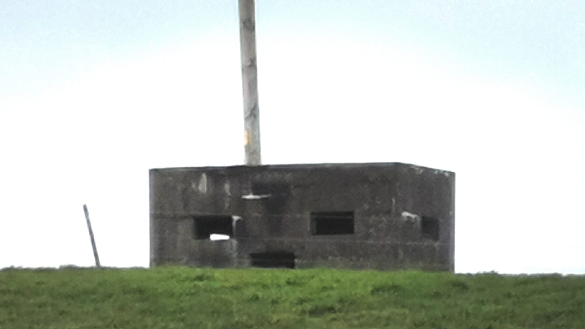 Pillbox on high ground close to Ballyvester Beach on the outskirts of Millisle, Co. Down. The pillbox faces inland forming part of a defensive stop-line.