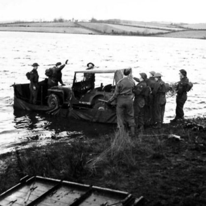 Soldiers of 72nd Independent Infantry Brigade, British Army construct a raft using an iron frame and a waterproof lorry cover at Corbet Lough near Banbridge, Co. Down. The new style of water-crossing enabled soldiers to transport a 30 CWT lorry, a Jeep, and an Anti-Tank Gun.