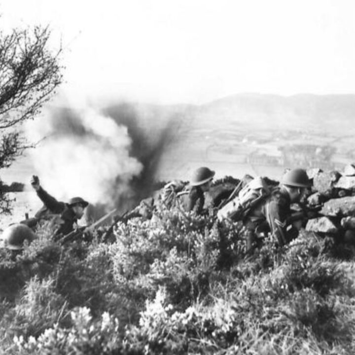Realistic battle scenes, gunfire, explosions, and cliff scaling play out in the countryside around Newry, Co. Down as soldiers of 2/5th Battalion, Lancashire Fusiliers, 59th (Staffordshire) Infantry Division undergo 'toughening up' training in Northern Ireland.