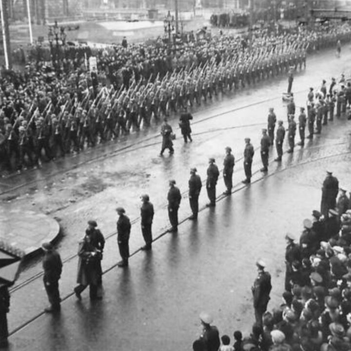 Soldiers from a battalion of the East Surrey Regiment march past the saluting base during a commemorative event to mark the 25th anniversary of the establishment of the Red Army. The Duke of Abercorn (Governor of Northern Ireland) took the salute on Red Army Day 1943 at Belfast City Hall.