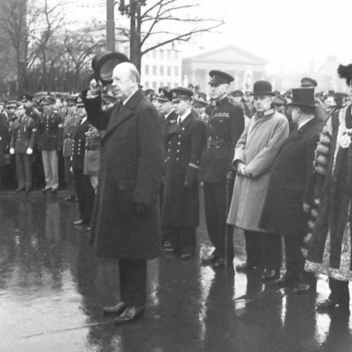 Naval Lieutenant Elagin, representing the Embassy of the U.S.S.R. in London is among the party at the saluting base during a commemorative event to mark the 25th anniversary of the establishment of the Red Army. The Duke of Abercorn (Governor of Northern Ireland) took the salute on Red Army Day 1943 at Belfast City Hall.