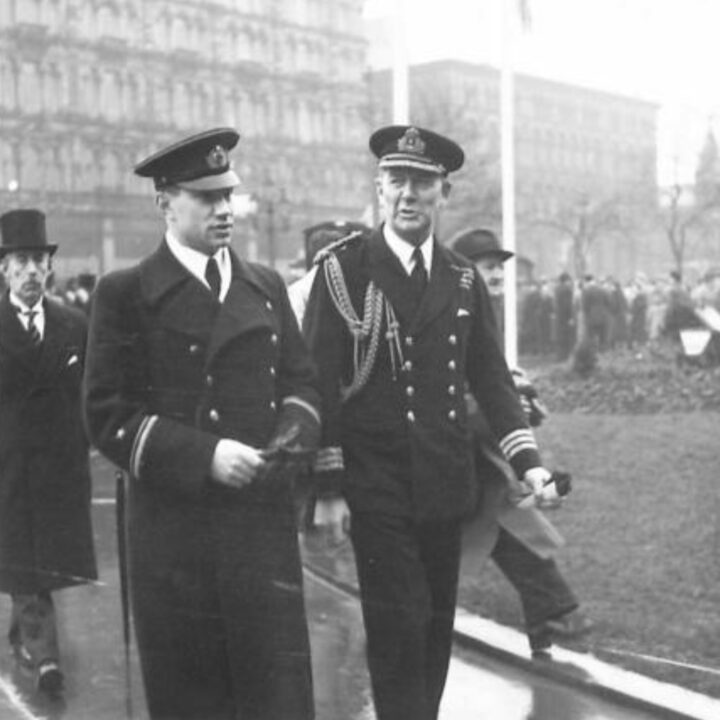 Commander Oscar Henderson D.S.O. with Naval Lieutenant Elagin, representing the Embassy of the U.S.S.R. in London at the saluting base during a commemorative event to mark the 25th anniversary of the establishment of the Red Army. The Duke of Abercorn (Governor of Northern Ireland) took the salute on Red Army Day 1943 at Belfast City Hall.