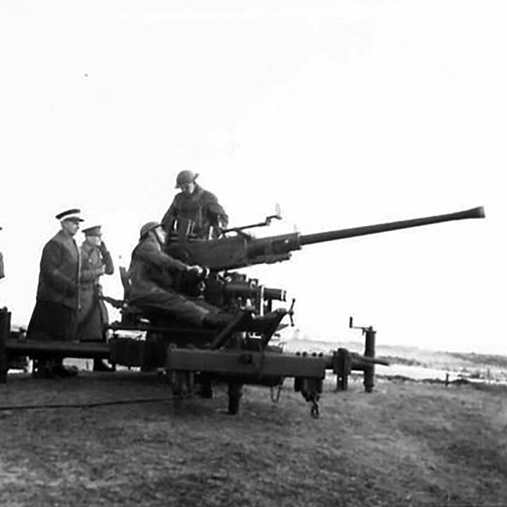 Gunners sighting a target before firing a Bofors Gun. This exercise at 17th Anti-Aircraft Practise Camp, Ballykinlar, Co. Down involved the firing of Bofors Guns at a 'kite' towed behind a military plane.