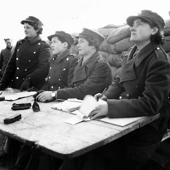 Members of the Auxiliary Territorial Service record the results of the firing test. This exercise at 17th Anti-Aircraft Practise Camp, Ballykinlar, Co. Down involved the firing of Bofors Guns at a 'kite' towed behind a military plane.