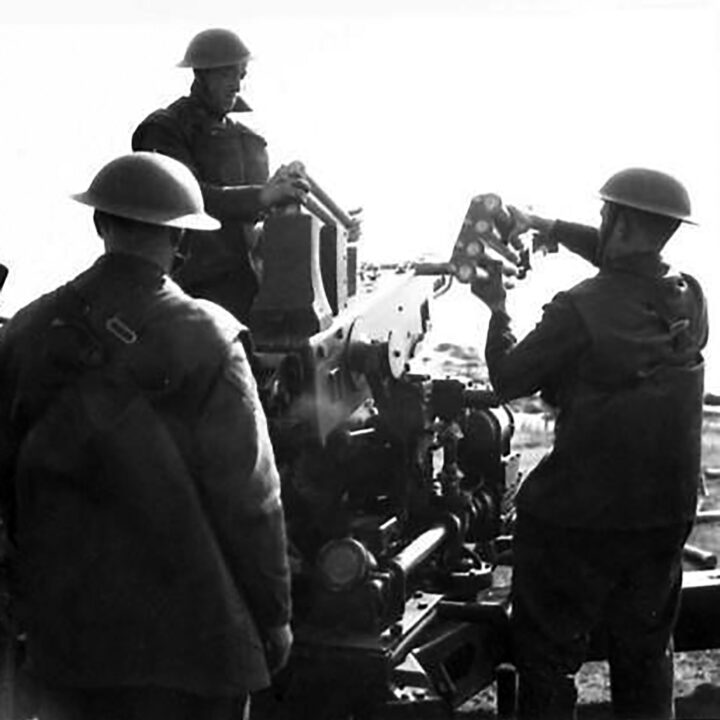 Gunners loading a Bofors Gun. This exercise at 17th Anti-Aircraft Practise Camp, Ballykinlar, Co. Down involved the firing of Bofors Guns at a 'kite' towed behind a military plane.