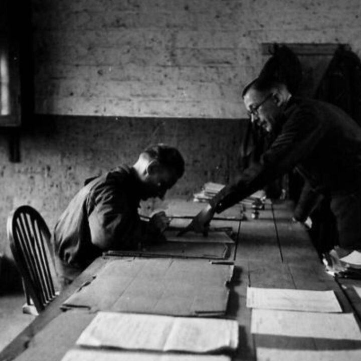 A Sergeant interviews a recruit and assists with the completion of tradesmen's forms during training with the British Army's General Service Corps at No. 12 Primary Training Centre, St. Patrick's Barracks, Ballymena, Co. Antrim.