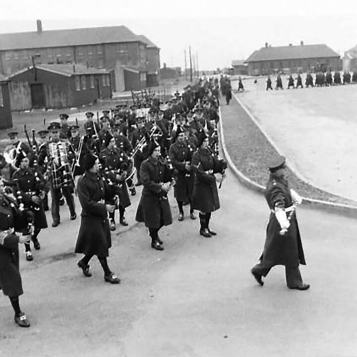 The Battalion march towards the parade ground lead by the Battalion Pipe Band. The event is the presentation of the St. Patrick's Day Shamrock to members of a Battalion of the Royal Irish Fusiliers at Ballykinler, Co. Down.