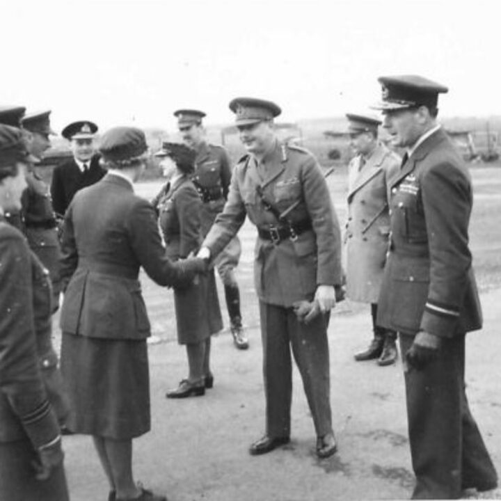 An officer of the Women's Auxiliary Air Force shakes hands with His Royal Highness The Duke of Gloucester on his arrival at R.A.F. Aldergrove, Co. Antrim.