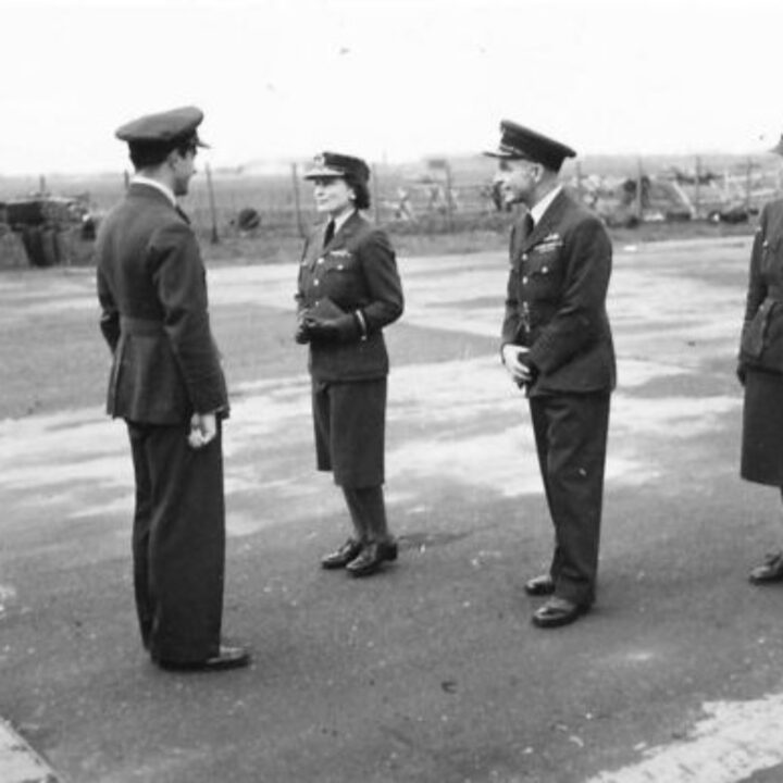 An officer of the Royal Air Force chats with Her Royal Highness The Duchess of Gloucester on her arrival at R.A.F. Aldergrove, Co. Antrim.