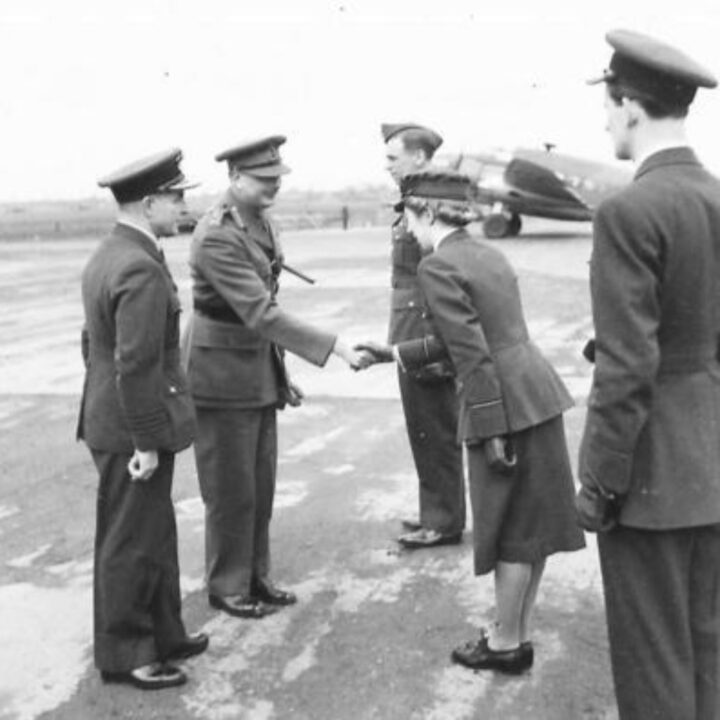 An officer of the Women's Auxiliary Air Force chats with His Royal Highness The Duke of Gloucester on his arrival at R.A.F. Aldergrove, Co. Antrim.