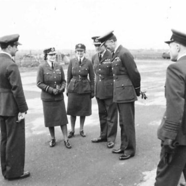 Officers of the Royal Air Force chat with Her Royal Highness The Duchess of Gloucester on her arrival at R.A.F. Aldergrove, Co. Antrim.