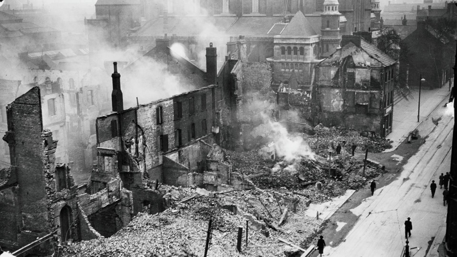 Clearance work underway following the destruction caused during the Belfast Blitz to the corner of York Street and Donegall Street. Belfast Cathedral remains standing in the background.