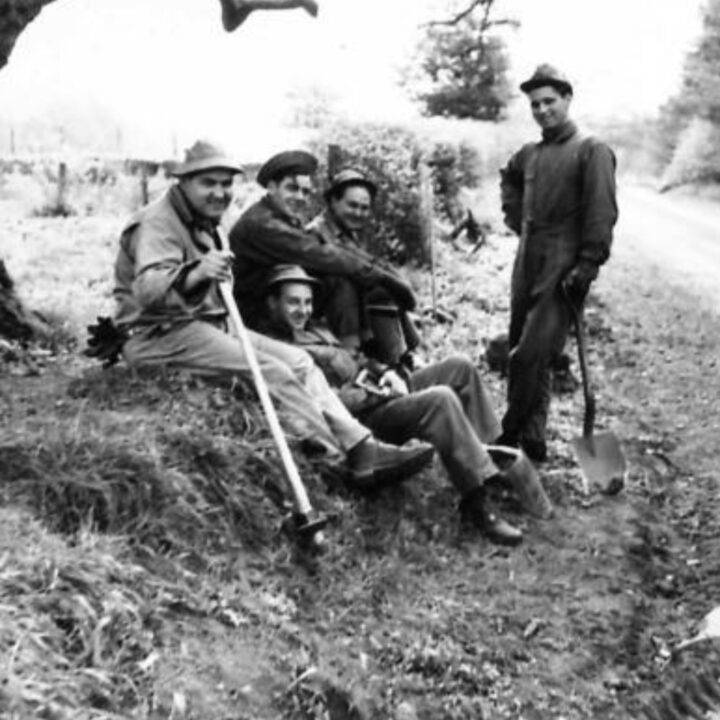 American soldiers take a well-earned rest on farmland near Shane's Castle, Randalstown, Co. Antrim. During the Second World War, soldiers based in Northern Ireland received tuition in agricultural techniques to help with the war effort.