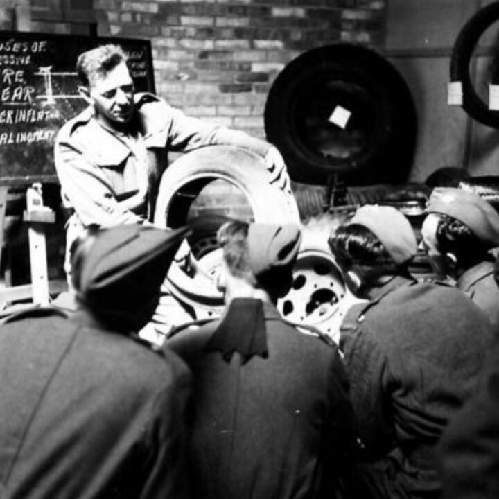 A Scottish Artificer Quartermaster Sergeant instructs a class on how to save tyres at a Command Vehicle Maintenance School at Thiepval Barracks, Lisburn, Co. Antrim.