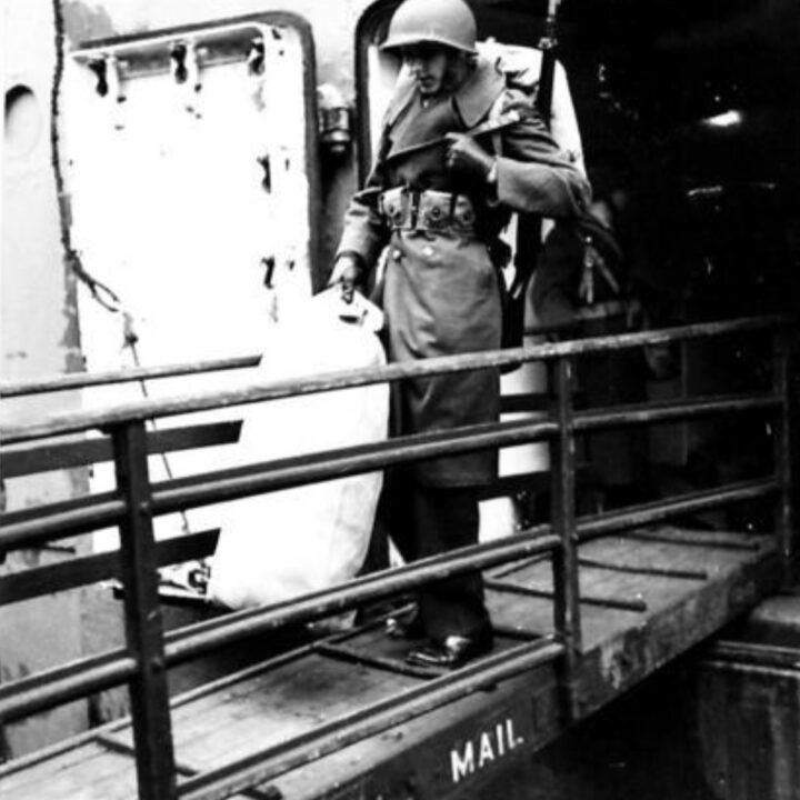 A soldier wearing a new and distinctive M1 'steel-pot' helmet descends the gangway as the third and largest contingent of United States Army soldiers arrived at Dufferin Dock, Belfast.