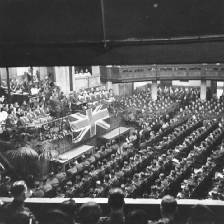 Reverend L.F. Hamel-Smith M.A. (Senior Chaplain to the Forces, Northern Ireland District) conducts a large church service for the forces in the Presbyterian Church's Assembly Buildings, Belfast.