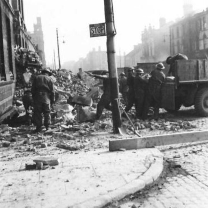 Soldiers of the Royal Berkshire Regiment assist with clearing up bomb damage in the aftermath of the Fire Raid of the Belfast Blitz.