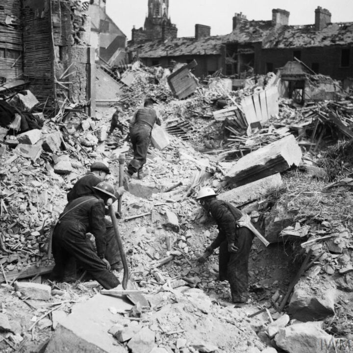 Soldiers assist with clearing up bomb damage at Newtownards Road, Belfast in the aftermath of the Fire Raid of the Belfast Blitz.