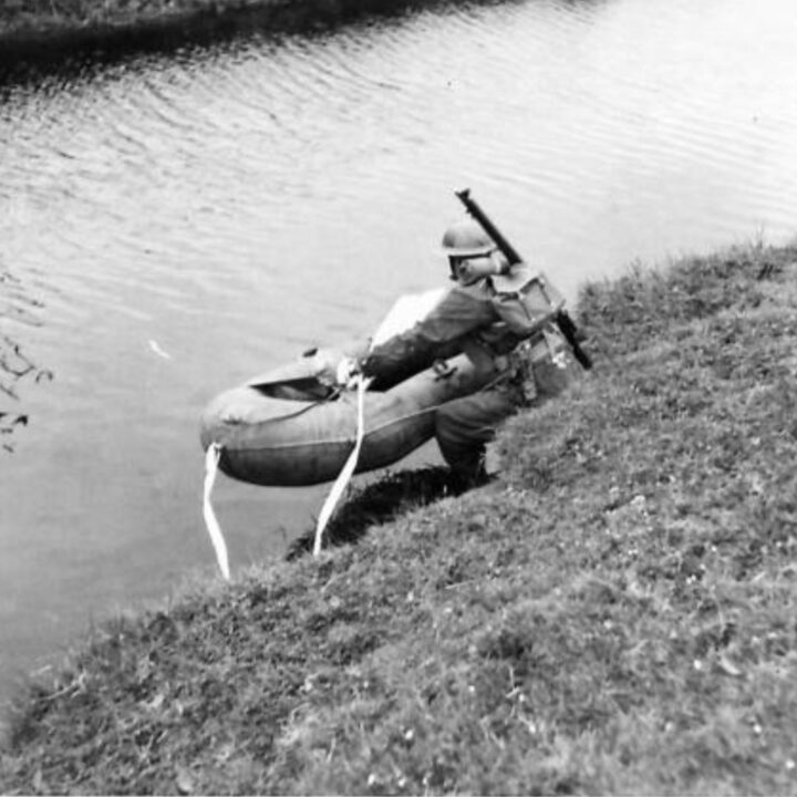 A rubber reconnaissance boat launched across the river during a demonstration by 61st Divisional Engineers at Agivey, Co. Londonderry.