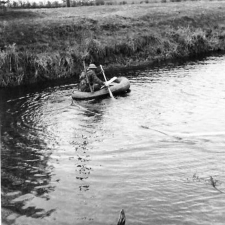 A rubber reconnaissance boat launched across the river during a demonstration by 61st Divisional Engineers at Agivey, Co. Londonderry.
