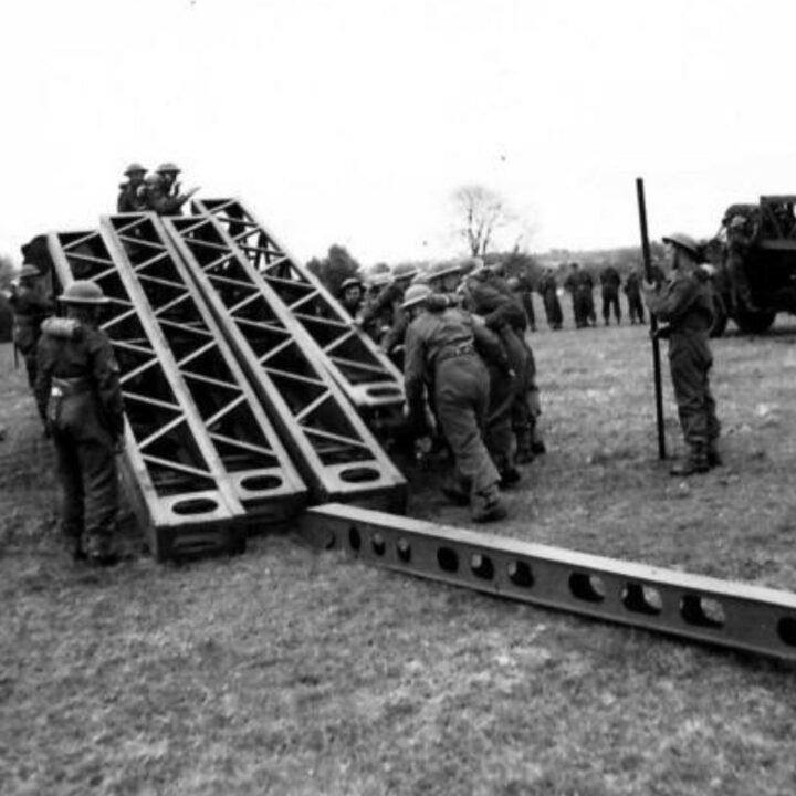 A party of sappers unloading hornbeams during a demonstration by 61st Divisional Engineers at Agivey, Co. Londonderry.