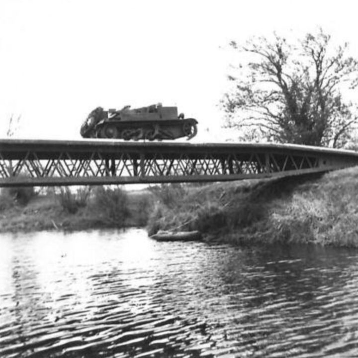 Universal Carriers cross the completed bridge during a demonstration by 61st Divisional Engineers at Agivey, Co. Londonderry.
