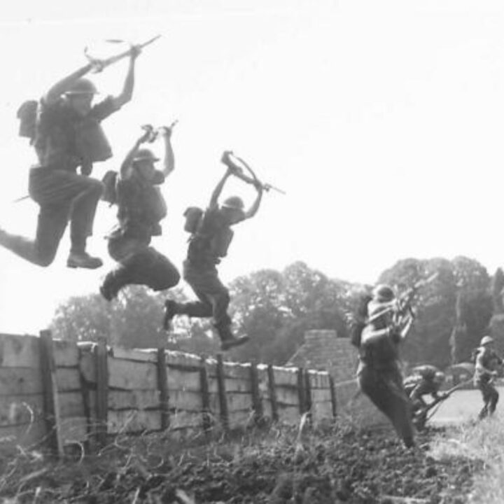 Soldiers of 8th (Nottinghamshire) Battalion, The Sherwood Foresters, 148th Independent Infantry Brigade clear an obstacle with bayonets raised during a training exercise near Muckamore, Co. Antrim.
