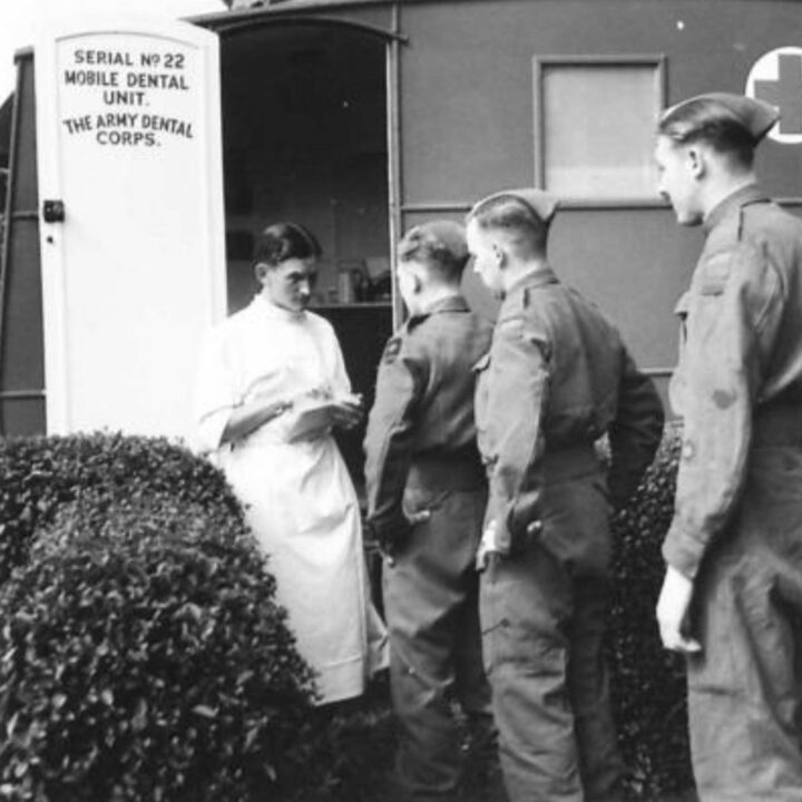 A dental orderly takes details from military patients awaiting treatment at No. 22 Mobile Dental Unit in Ballycastle, Co. Antrim.