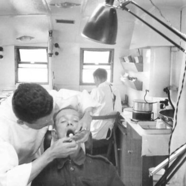 A patient receives dental treatment inside the van of No. 22 Mobile Dental Unit in Ballycastle, Co. Antrim.