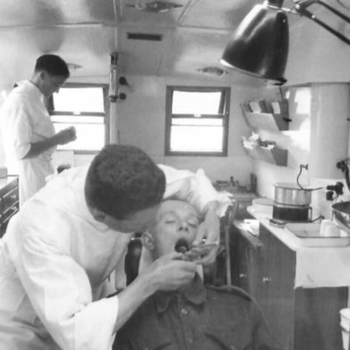 A patient receives dental treatment inside the van of No. 22 Mobile Dental Unit in Ballycastle, Co. Antrim.