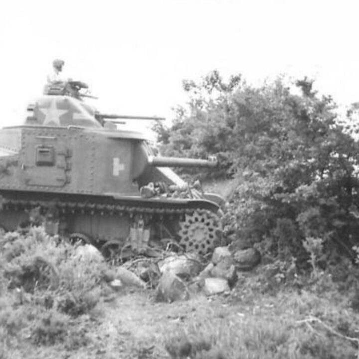 An M3 Lee Medium Tank of a United States Army Armored Division crosses hedgerows and obstacles as part of Exercise Defiance near Carrickfergus, Co. Antrim.