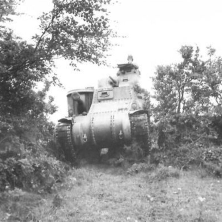 An M3 Lee Medium Tank of a United States Army Armored Division crosses hedgerows and obstacles as part of Exercise Defiance near Carrickfergus, Co. Antrim.