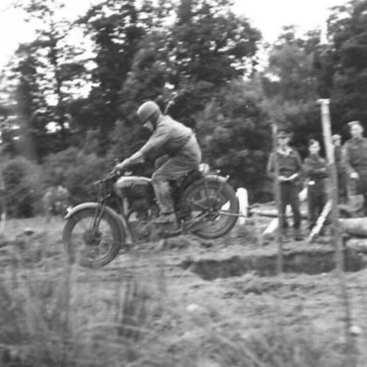Soldiers from 59th (Staffordshire) Reconnaissance Regiment, 59th (Staffordshire) Infantry Division taking part in motorcycle time trials in what the photographer describes as a 'Busman's Holiday' during downtime in training near Markethill, Co. Armagh.