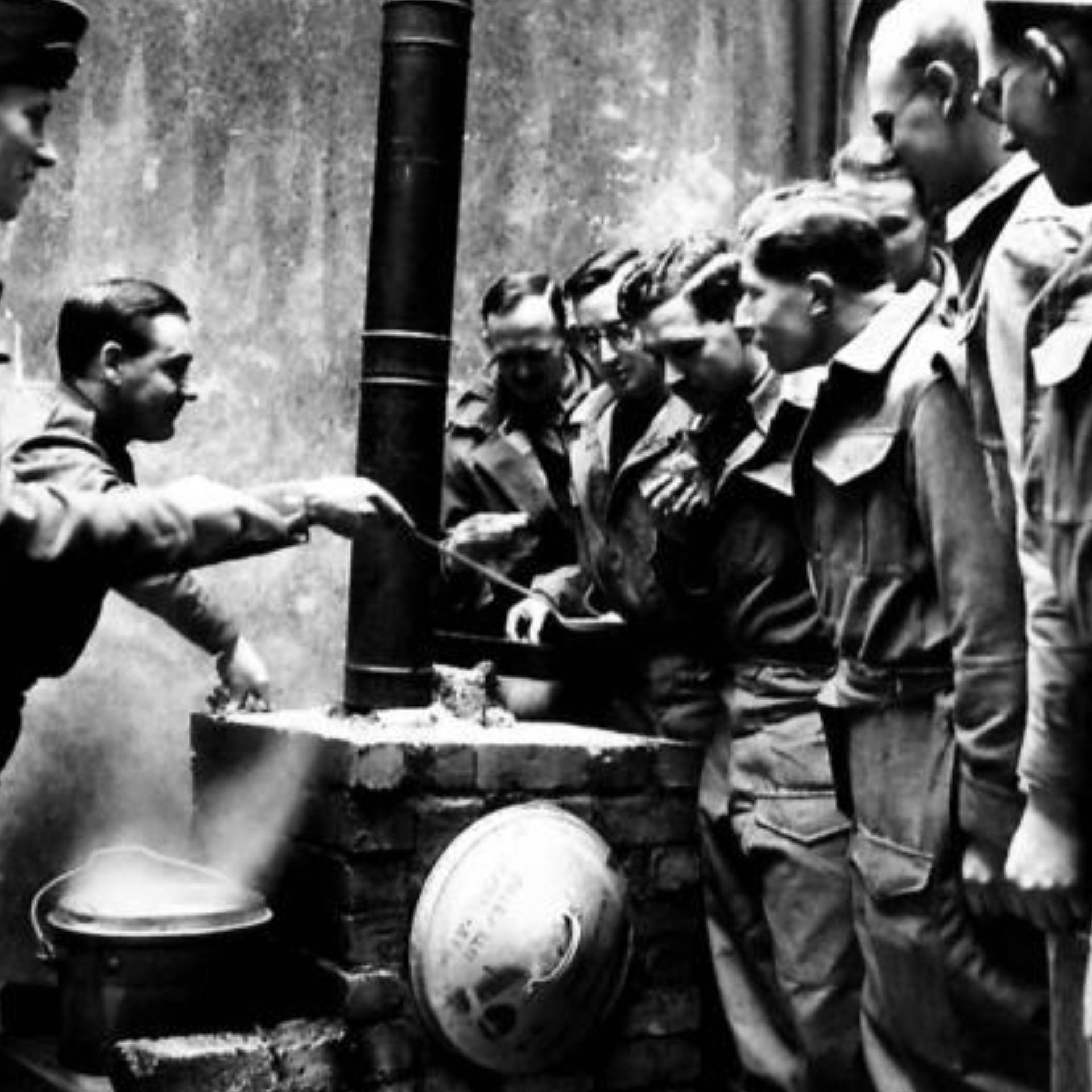 Fine oxtail soup prepared in an improvised field kitchen using a bin lid as an oven door at 61st Division Officer's Messing Course at Portrush, Co. Antrim.