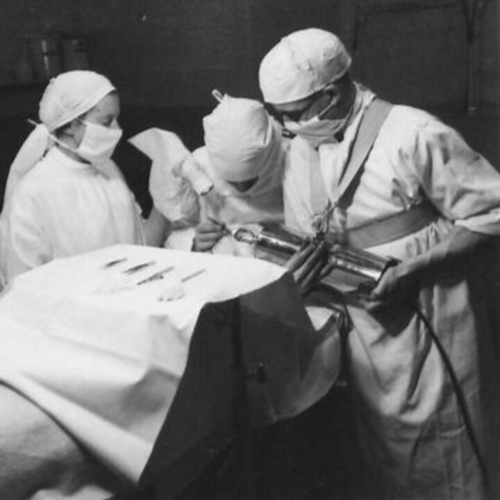 A leading Ophthalmological and Optical Specialist operates on a soldier extracting steel bodies from the eye by magnet in the operating theatre of a Military Ophthalmic Centre at No. 31 (London) General Hospital, Musgrave Park, Belfast.