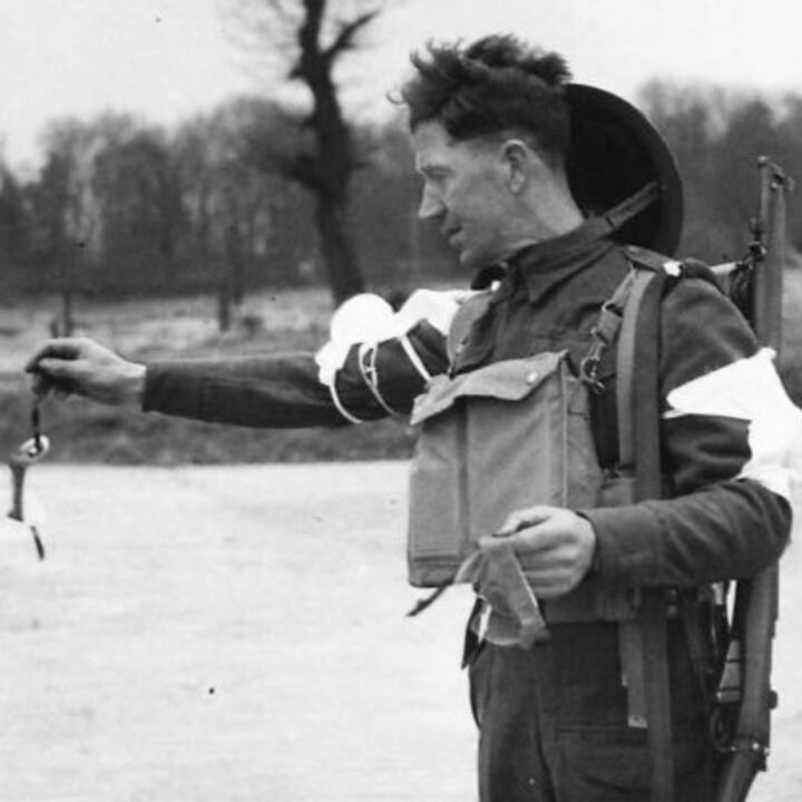 A soldier throwing away and replacing his soiled eye shield demonstrates the right thing to do during a spray gas attack. These illustrative photographs are from a demonstration held in Northern Ireland.