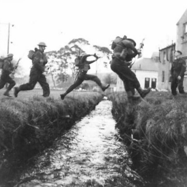 Soldiers of 2/5th Battalion, Lancashire Fusiliers partake in cross-country exercises in full kit while training near Keady, Co. Armagh.