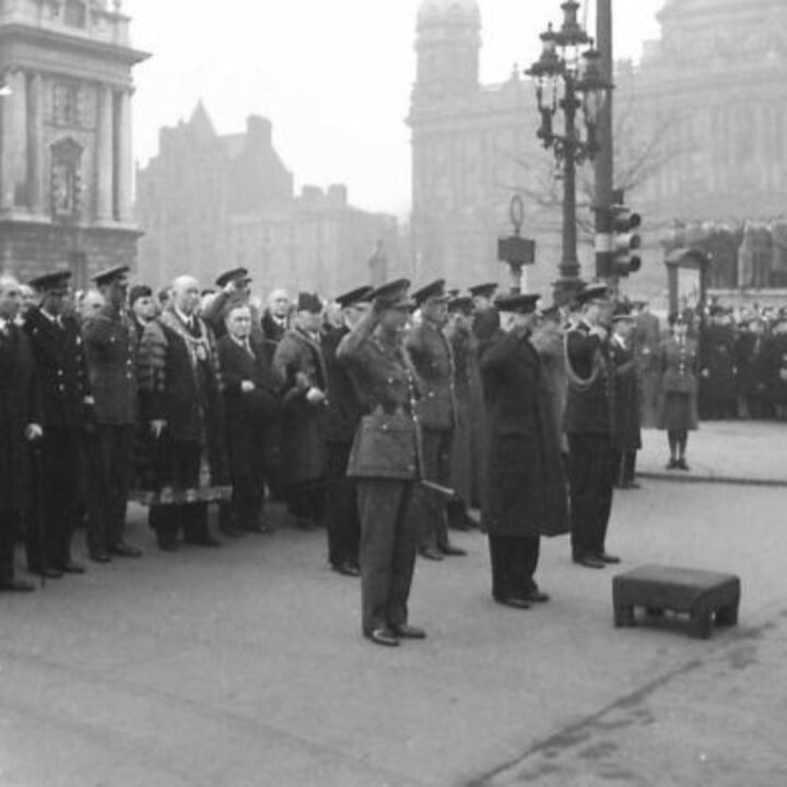 Lieutenant General Sir Alan Gordon Cunningham K.C.B, D.S.O., M.C. (General Officer Commanding Northern Ireland) and Mr. Albert Victor Alexander (First Lord of the Admiralty) are among the dignitaries at the saluting base for a parade marking the 26th anniversary of the Red Army at Belfast City Hall, Belfast.