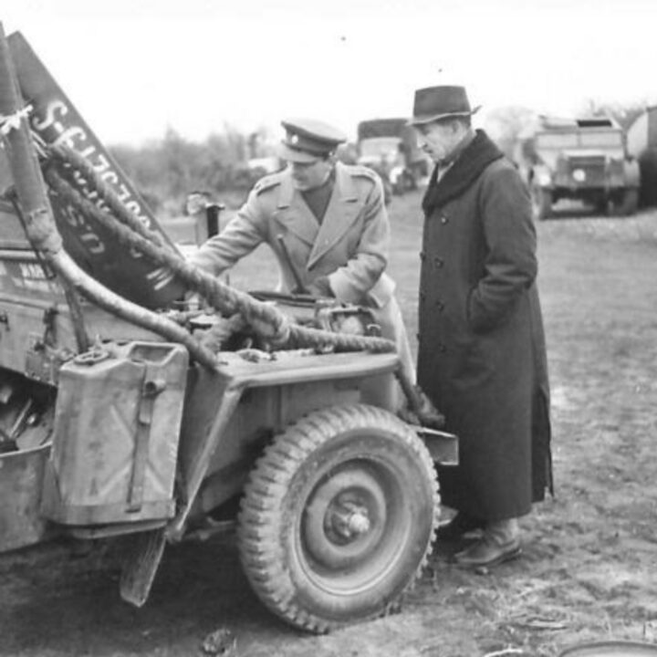 The Right Honourable Sir Basil Brooke (Prime Minister of Northern Ireland) and Lieutenant Colonel W.C. Forde inspect a military jeep at Lady's Bay, Lough Neagh while observing American vehicles carrying out waterproofing testing.