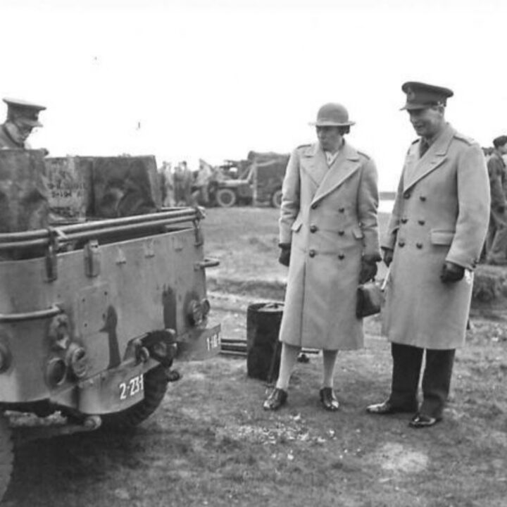 Lieutenant General Sir Alan Gordon Cunningham K.C.B., D.S.O., M.C. (General Officer Commanding Northern Ireland) and Lady Brooke inspect a military jeep at Lady's Bay, Lough Neagh while observing American vehicles carrying out waterproofing testing.